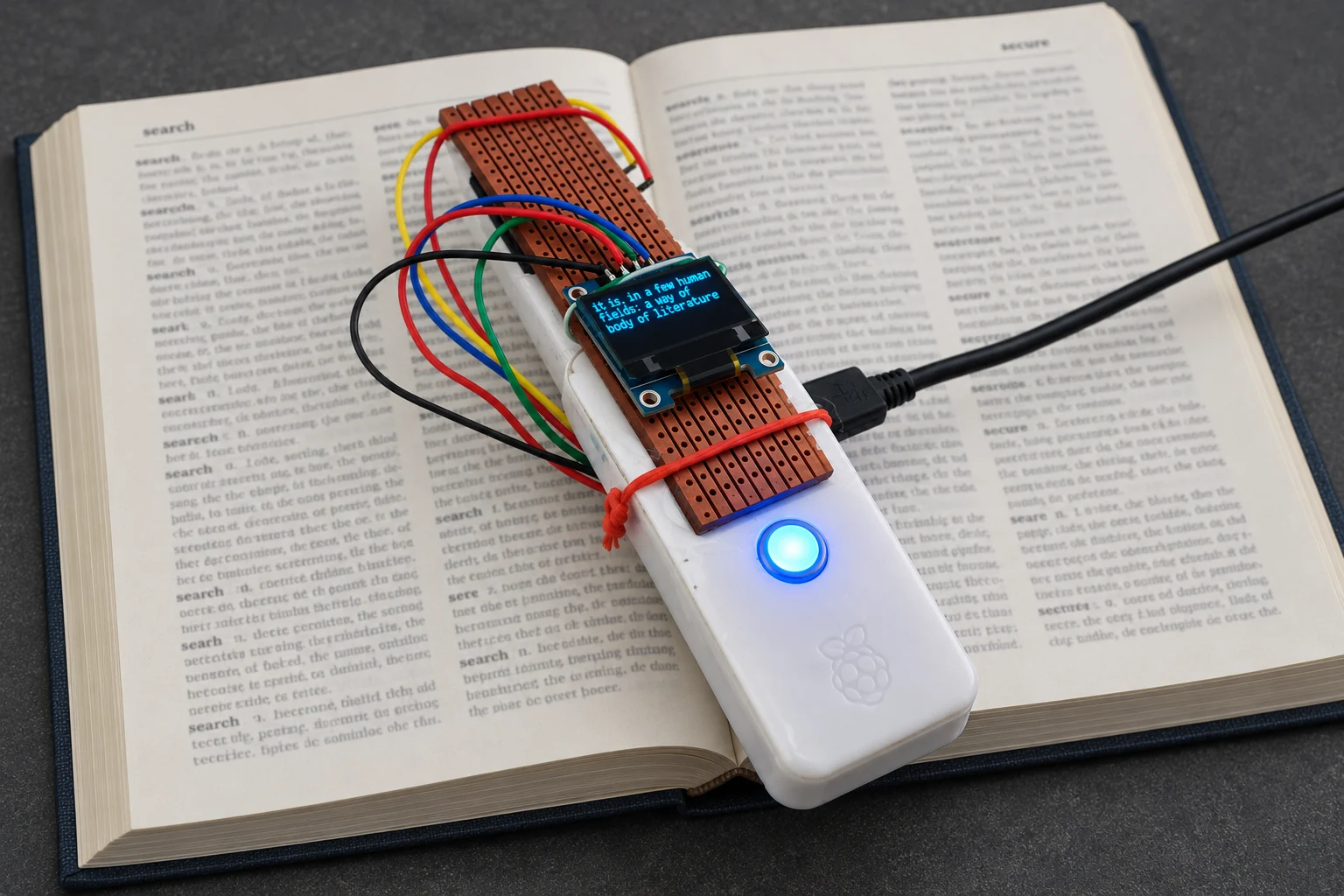 Enlarge an edited view of the DePen optical text scanner resting on an open book